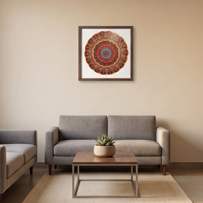 A modern living room setup featuring a gray sofa and matching armchair arranged around a low wooden coffee table on a beige rug. A colorful circular mandala art print in a square frame hangs on the beige wall above the sofa.